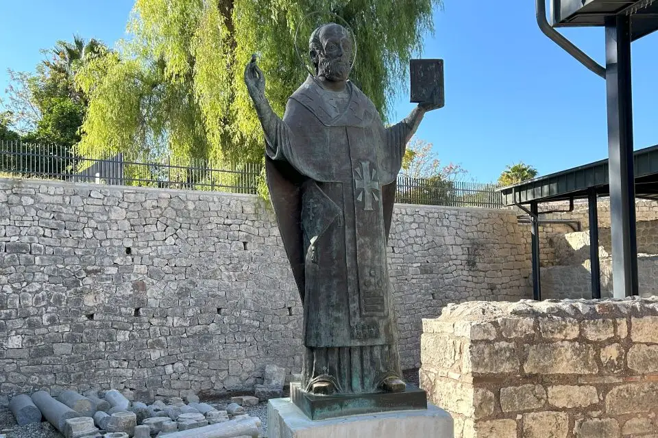 A statue of St. Nicholas standing outside his namesake church in Demre, honoring the saint's legacy