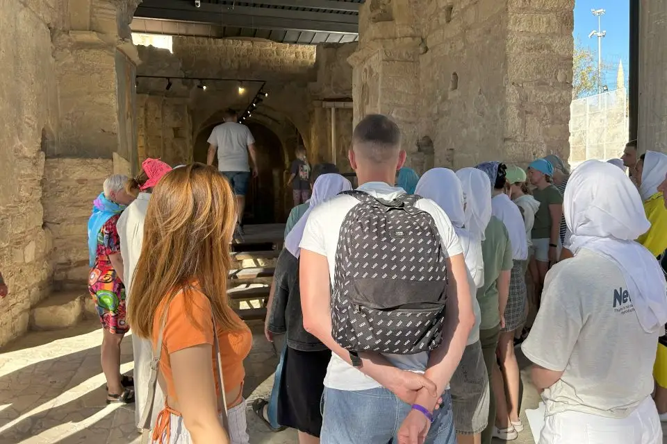 Demre Day Tour from Antalya - Visitors entering the interior of St. Nicholas Church, exploring its historic halls and artifacts.