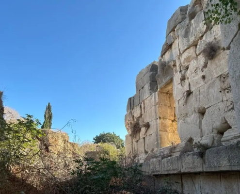 Weathered stone walls within the ancient ruins of Myra, highlighting the city's resilient structure