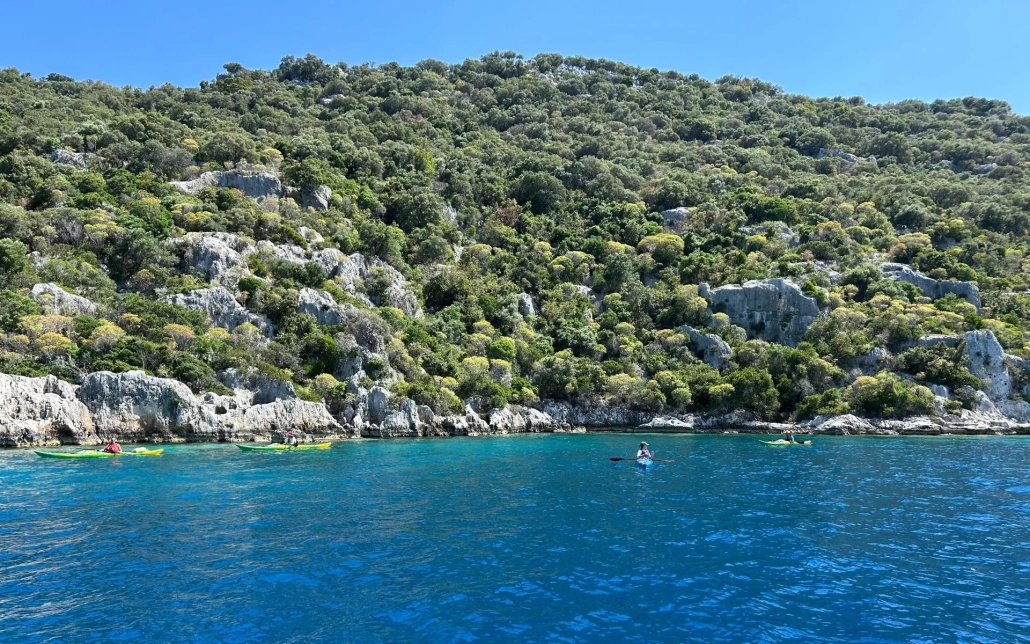 Two kayaks with adventurers exploring the scenic waters of Kekova