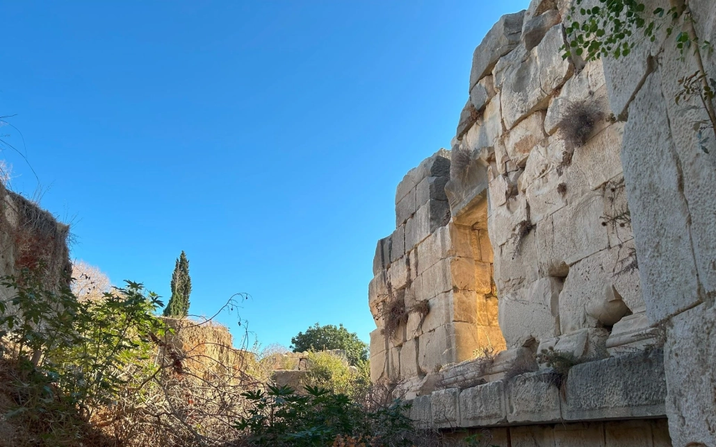Lycian rock-cut tombs and ruins at Myra Ancient City with clear blue sky in Demre, Turkey.