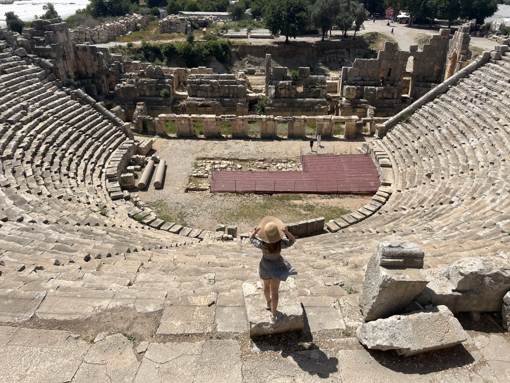 Solo traveler looking over the vast Roman theater at Myra Ancient City, Demre.